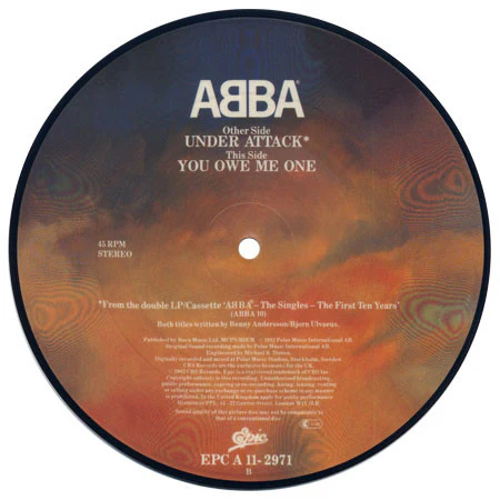 ABBA, Under Attack / You Owe Me One (Epic; EPC A 11-2971, UK 1982, Clear Plastic Sleeve, Picture Disc) 7" VG+/VG+ - Image 2